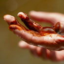 Boat captain shows oil on his hands