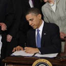 Photo: Obama signs historic $938 billion overhaul