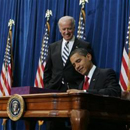Photo: Obama signs stimulus bill, readies homeowner plan