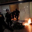 Photo: Anti-Trump protests turn violent: Cops clash with 6,000-strong crowd in Oakland and activists block roads in LA amid nationwide demonstrations